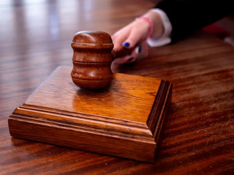 In Wednesday's daily devotional, a judge strikes her gavel in sentencing someone in court.