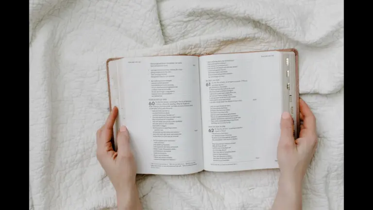 In Friday's daily devotional, a woman's hands are shown holding an open Bible as if reading or studying.