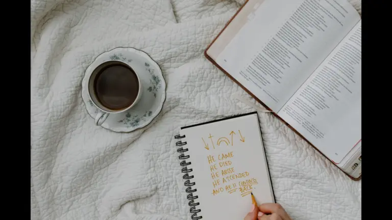 In Monday's daily devotional, a person studies the Bible with coffed and notepad close.