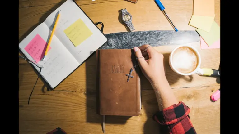 In Friday's daily devotional, a person's Bible study area has an open Bible, coffee, and notebook
