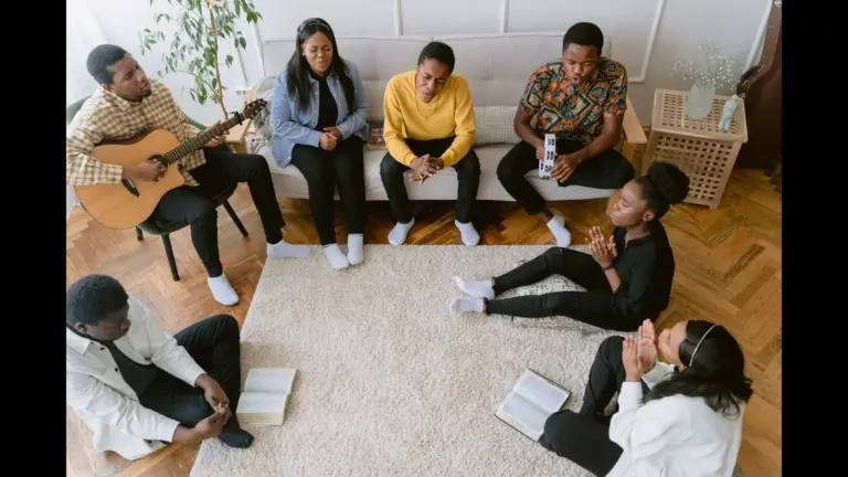 In Tuesday's daily devotional, a group Bible study plays a a guitar and sings unto the Lord.