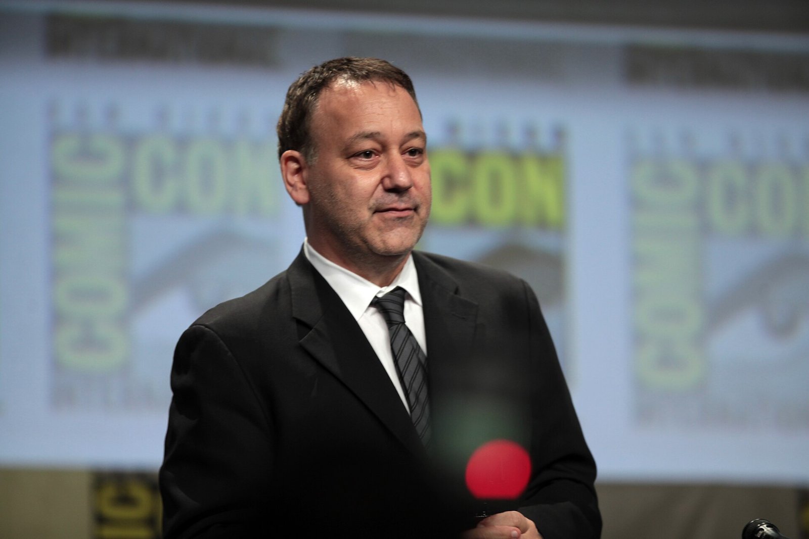 Producer Sam Raimi speaking at San Diego Comic-Con in 2014; Raimi is producing Every House Is Haunted