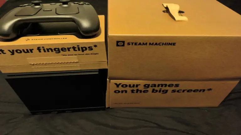 Steam Machine and Steam Controller with boxes that say "Your games on the big screen, at your fingertips."