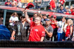 Drew Carey, host of the Undercover Boss reboot, waves to fans at a 2019 celebrity softball game in Cleveland