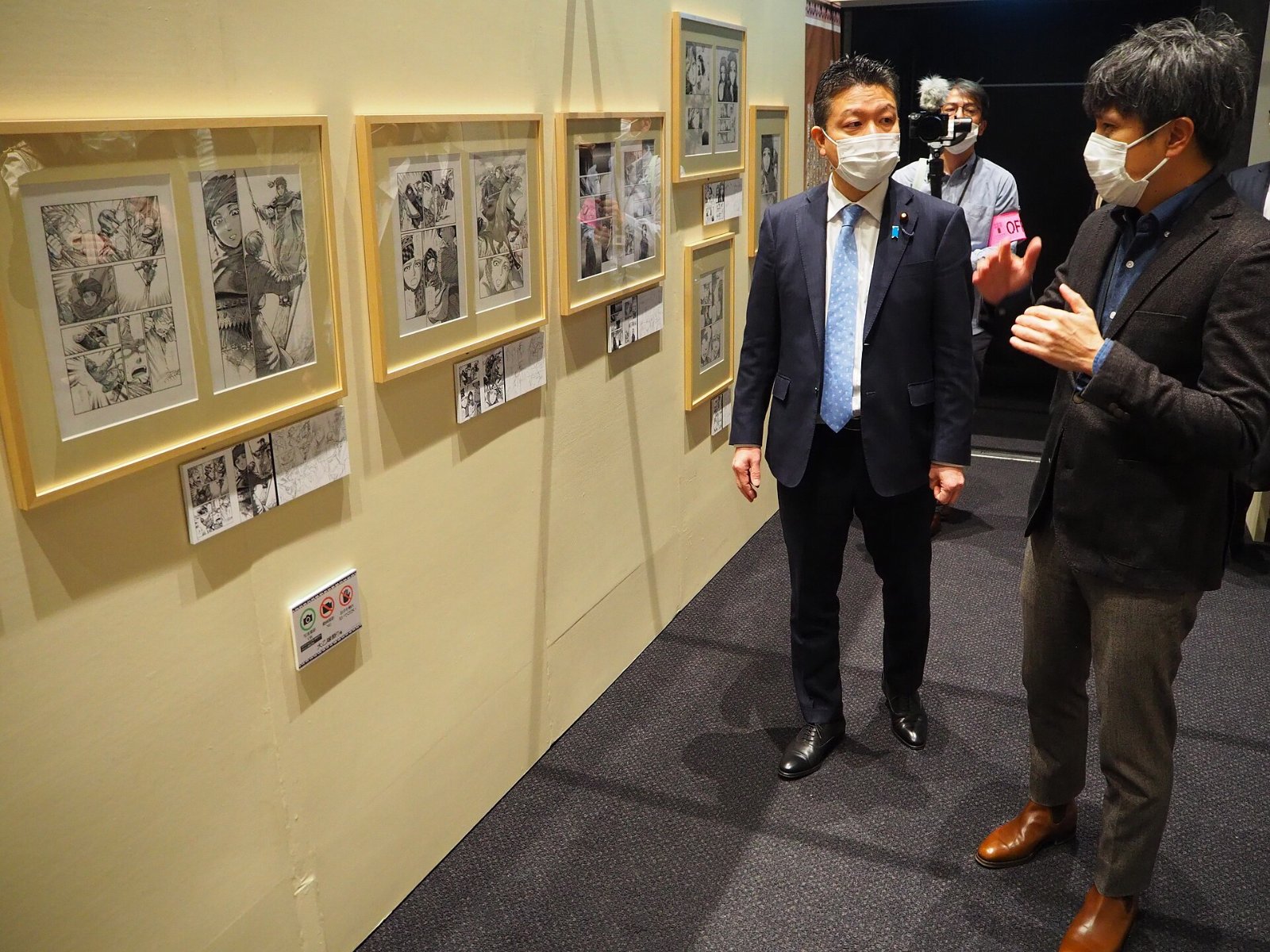 Japanese official Taro Honda views the 2022 original art exhibition for the A Bride's Story manga at Tokorozawa Sakura Town