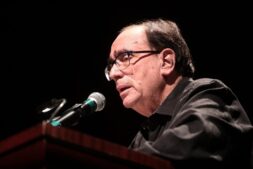Author R.L. Stine, whose Afraid of Clowns movie is headed to Tubi, speaks at a microphone during a 2019 event in Phoenix
