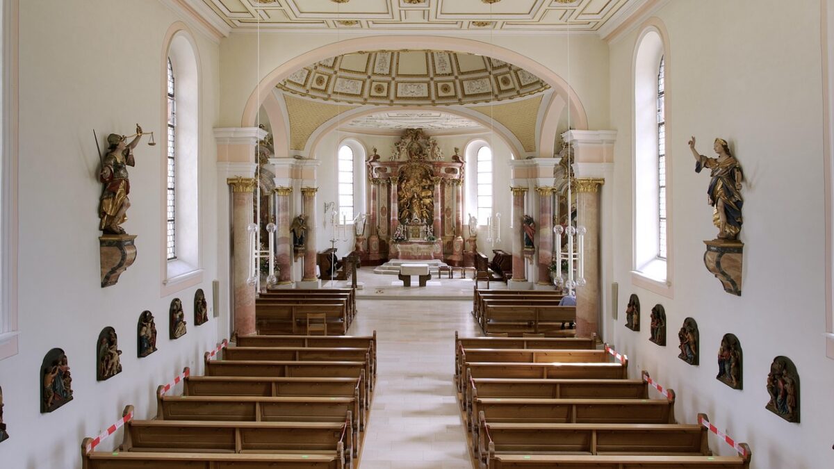 Church interior with wooden pews, a quiet setting for a Christian Hedonism devotional on joy