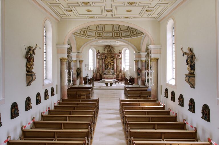 Church interior with wooden pews, a quiet setting for a Christian Hedonism devotional on joy
