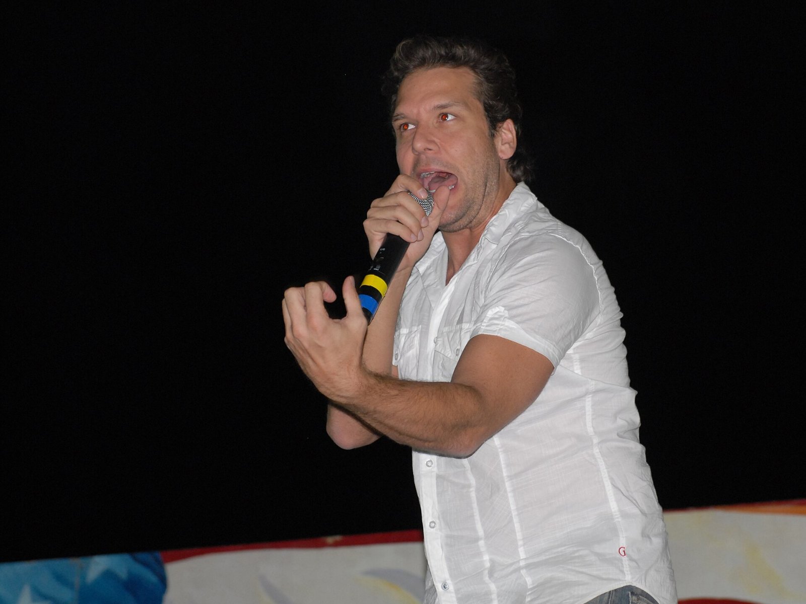 Comedian Dane Cook performs on a USO tour; the Dane Cook brother theft is the subject of his documentary Funny Money