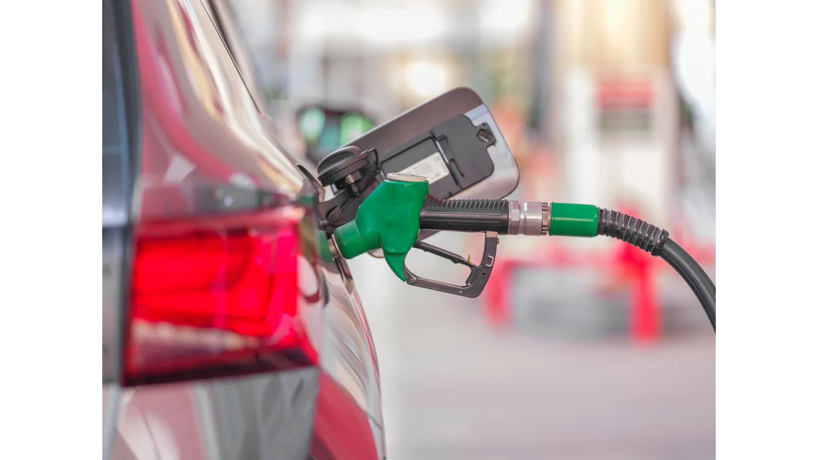Fuel pump nozzle in a car, as Europe diesel reserves draw U.S. pressure over record fuel prices
