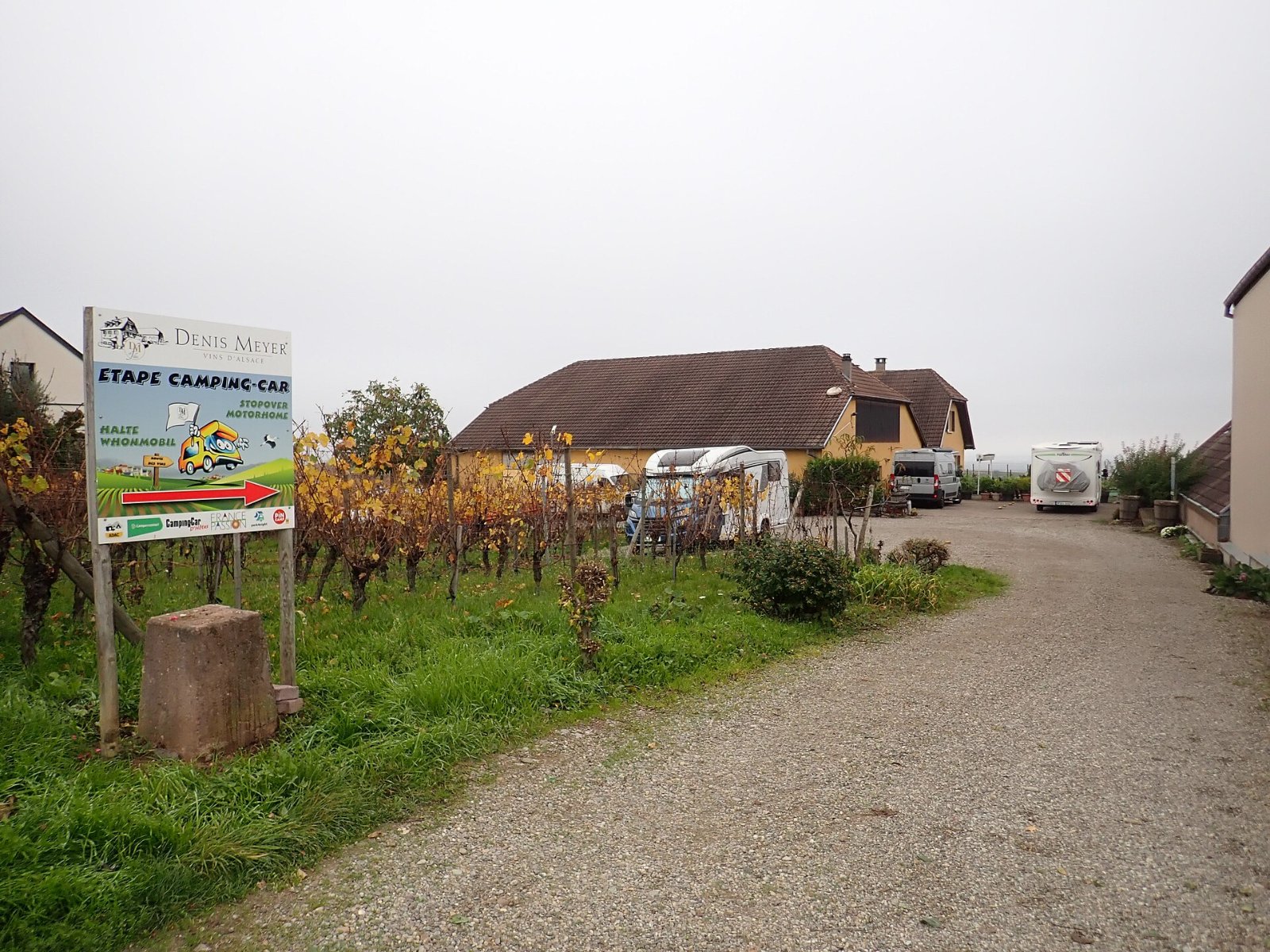 Motorhomes parked at a winery stopover beside vineyards in Alsace, France, the kind of overnight stay at the heart of the Harvest Hosts acquisition