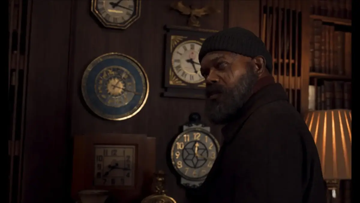 Samuel L. Jackson embodies Nick Fury, standing before a wall of clocks, representing his character in the 2023 series Secret Invasion. He will return in 2027's "Avengers: Secret Wars"