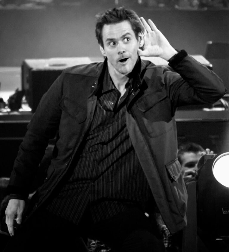 Jim Carrey cups his ear on stage at the Premios 40 Principales in Madrid in 2008, years before Jim Carrey married Min Ah