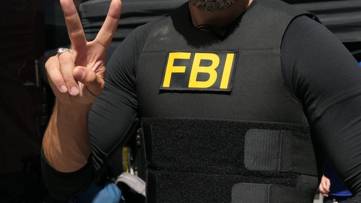 Zeeko Zaki wearing an FBI vest in an archival photograph, pictured for the FBI season 9 report
