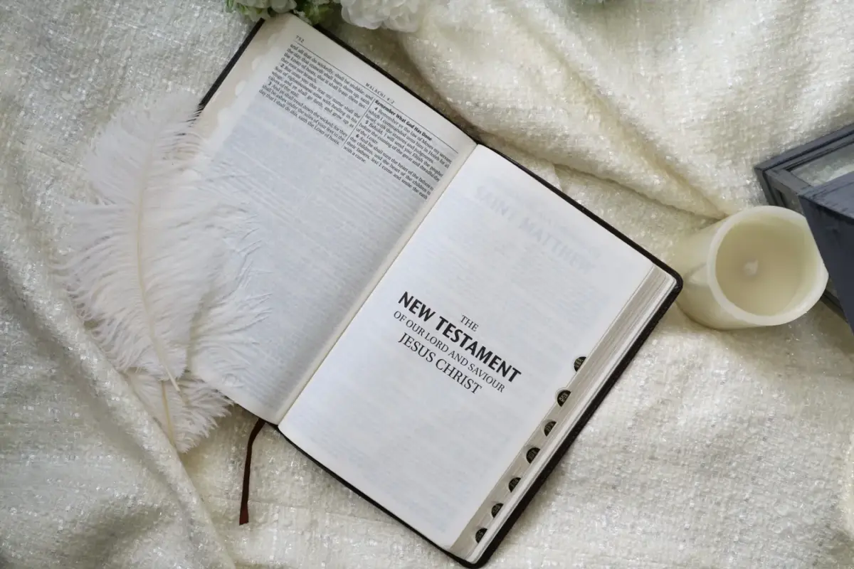 In Friday's devotional, a Bible is opened to the New Testament.