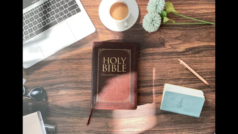 In Friday's daily devotional, a study area is set up with Bible, notebook, computer, and pencil.