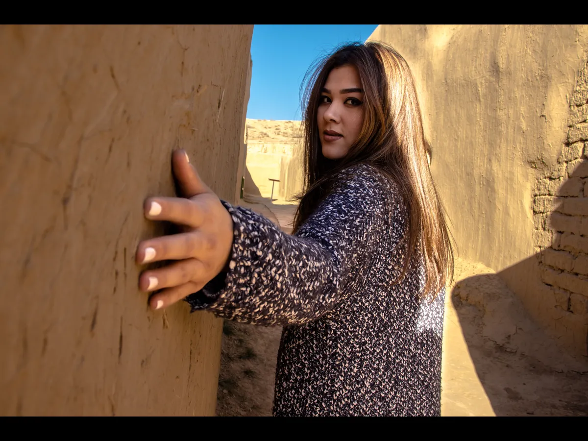 In Thursday's daily devotional, a woman is seen inside a city wall similar to Rahab who needed rescue.