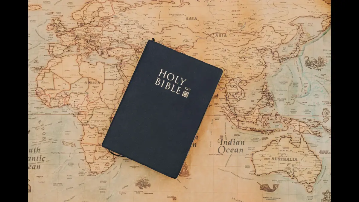 In Friday's daily devotional, a Bible sits on top of a world map.
