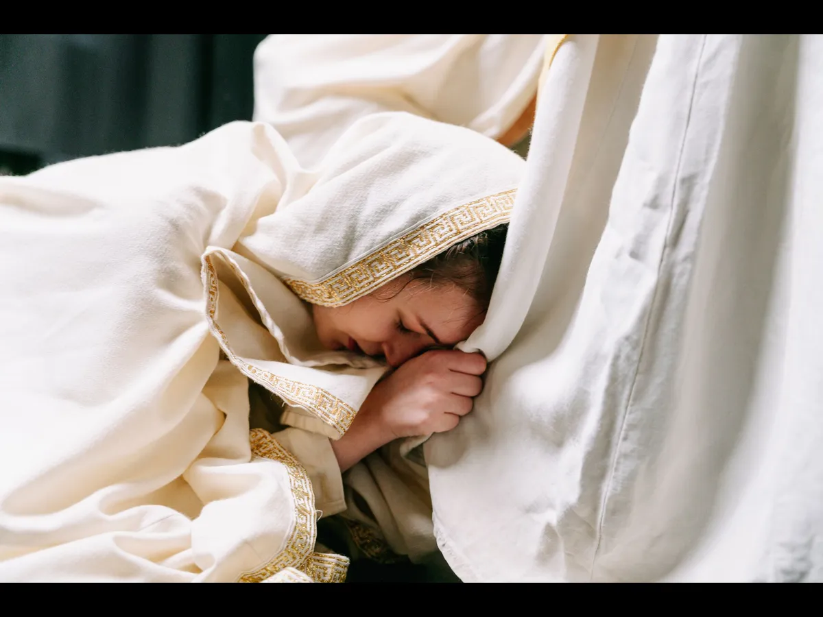 In Tuesday's daily devotional, a woman falls at Jesus' feet in this depiction from the Bible.