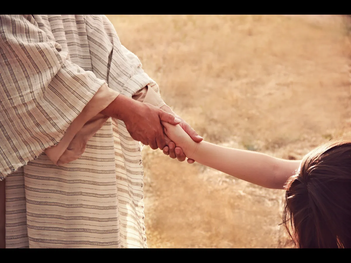 In Friday's daily devotional, a reenactment of a healing scene with Jesus and a woman in need of healing is shown.