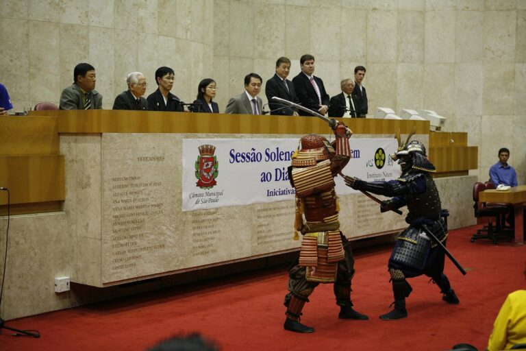 Martial artists in samurai armor demonstrate sword techniques, the kind of action showcased on the Samurai Vs Ninja channel