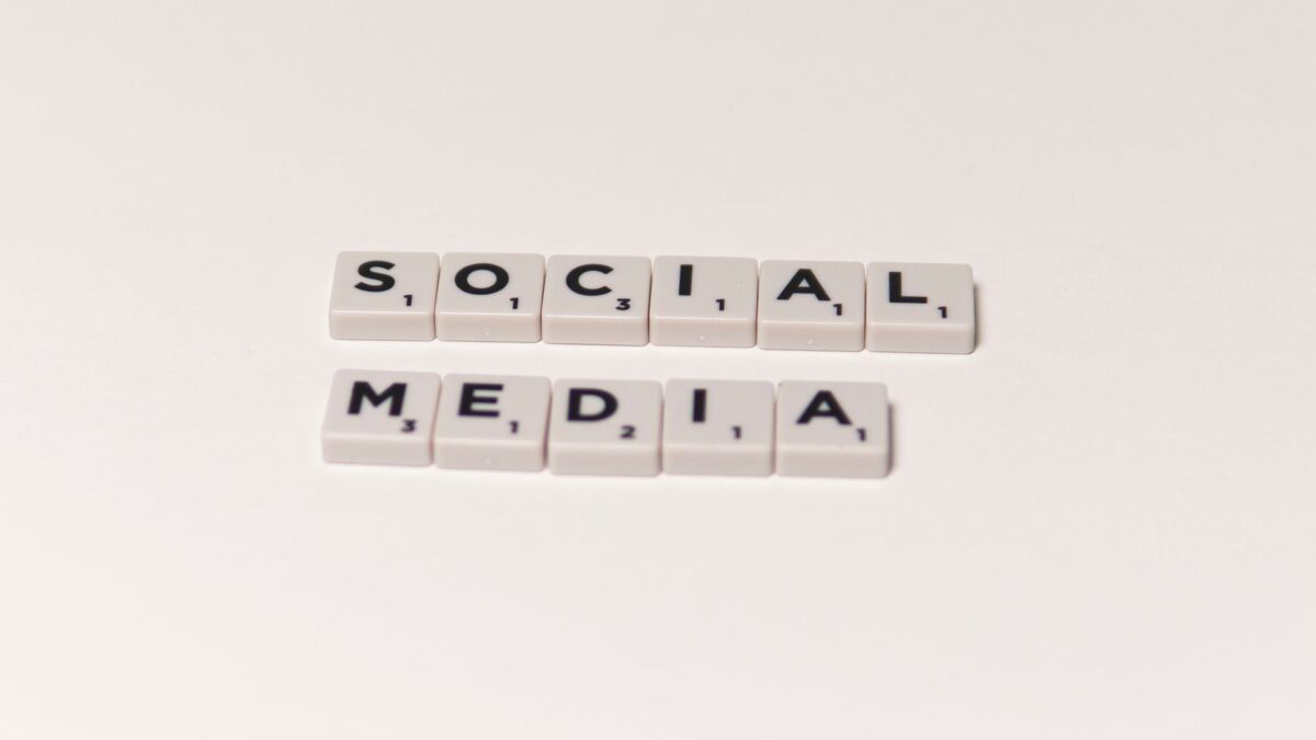 Scrabble tiles spelling social media, a symbol of social media anxiety