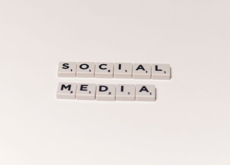 Scrabble tiles spelling social media, a symbol of social media anxiety