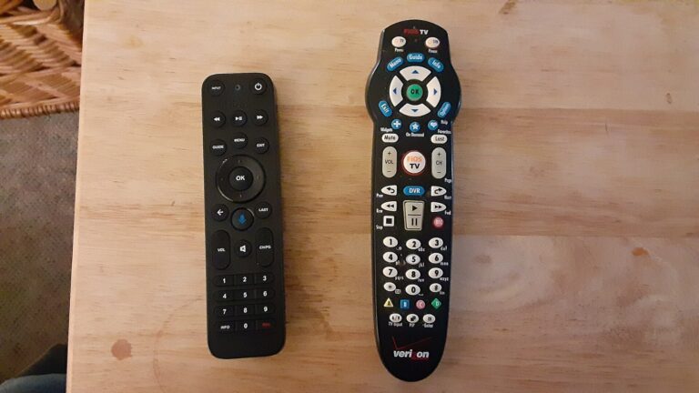 Two Verizon Fios TV remote controls on a wooden table, the service hit by the Starz Fios blackout